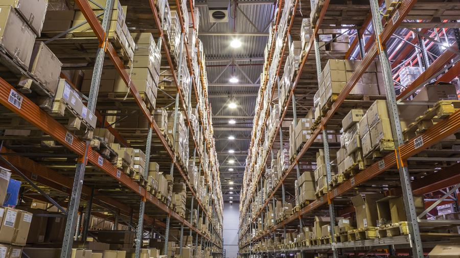 Warehouse shelving stacked with equipment
